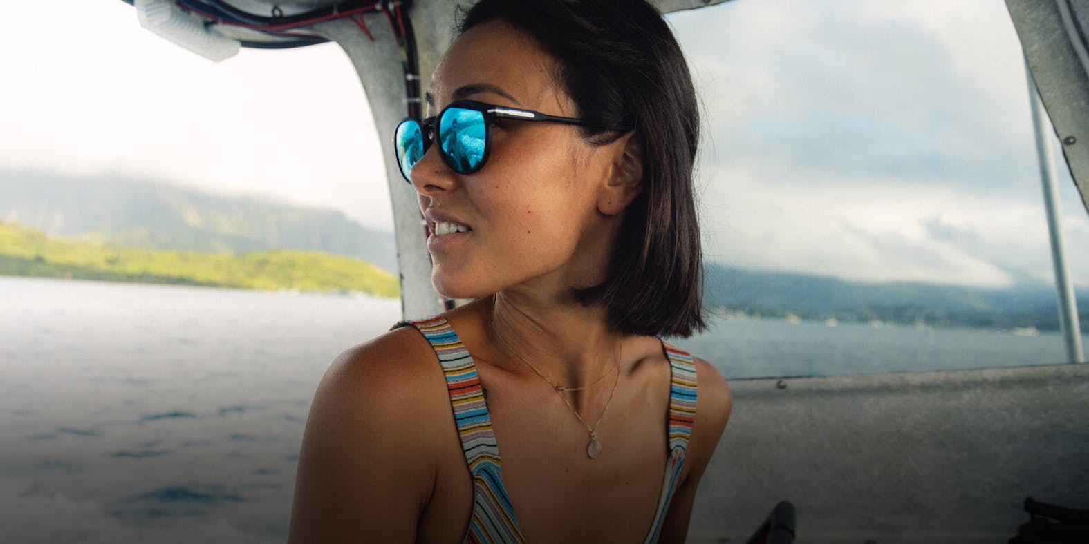 Woman wearing tank top on lake