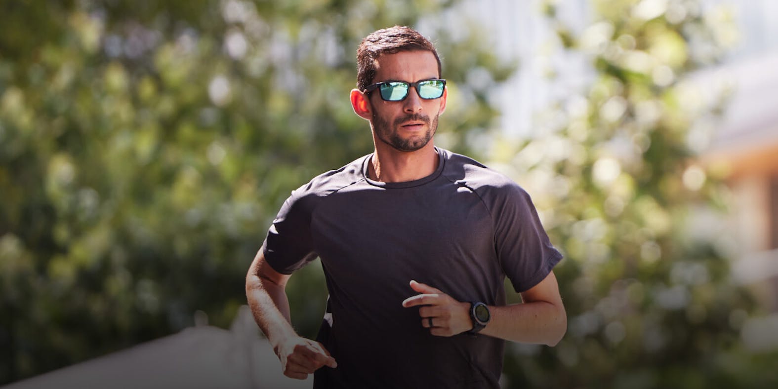Man running in mirrored ROKA sunglasses