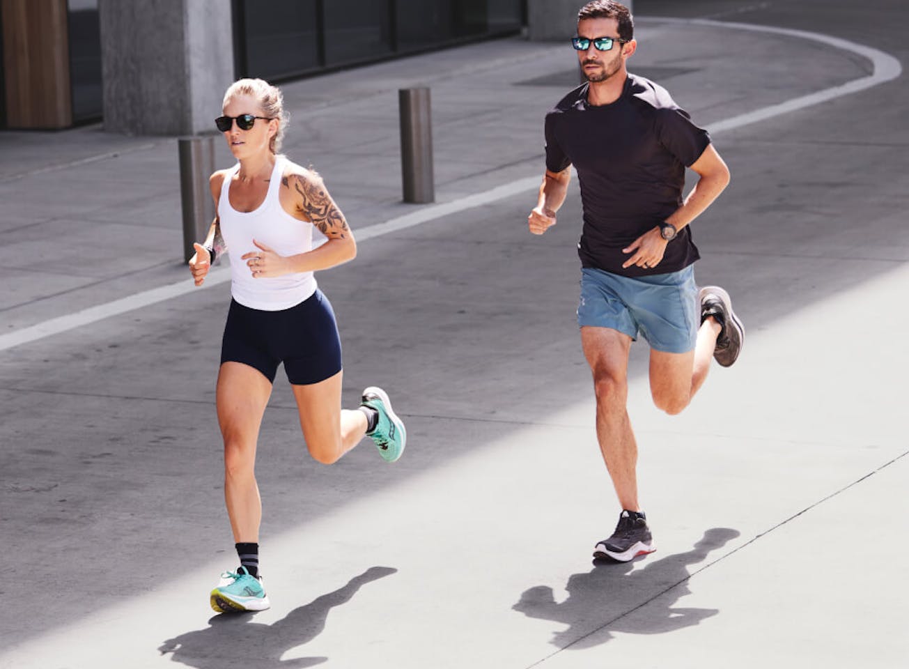 Man and woman jogging in street