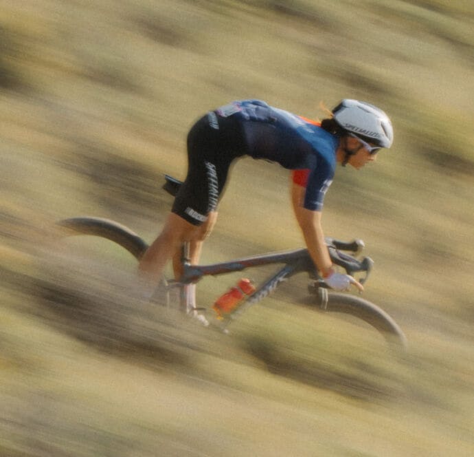 Woman mountain biking downhill