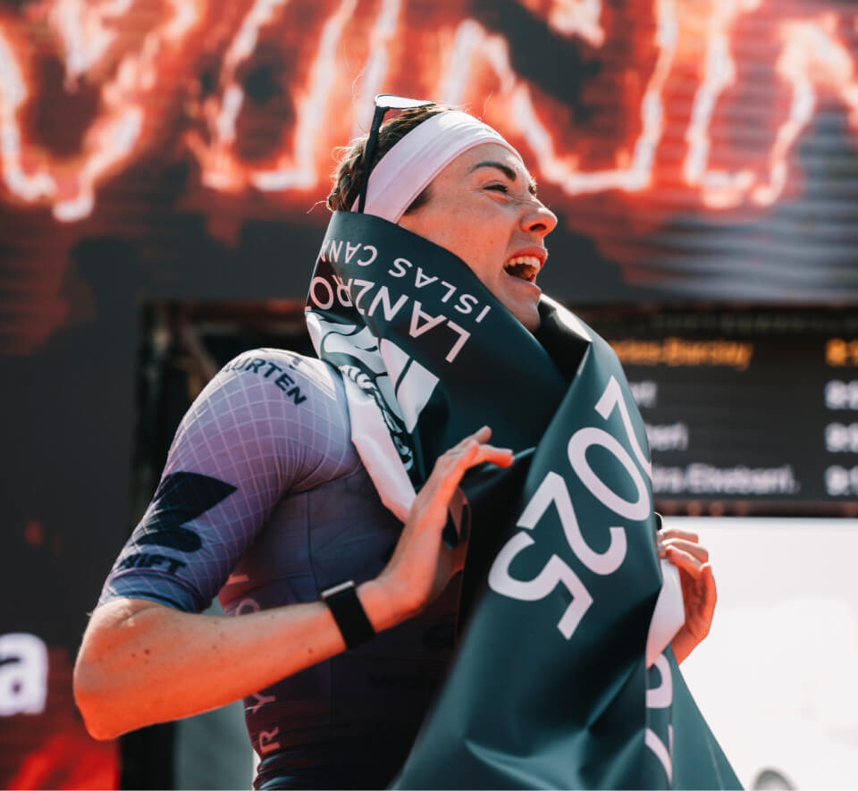 Woman celebrating a triathlon