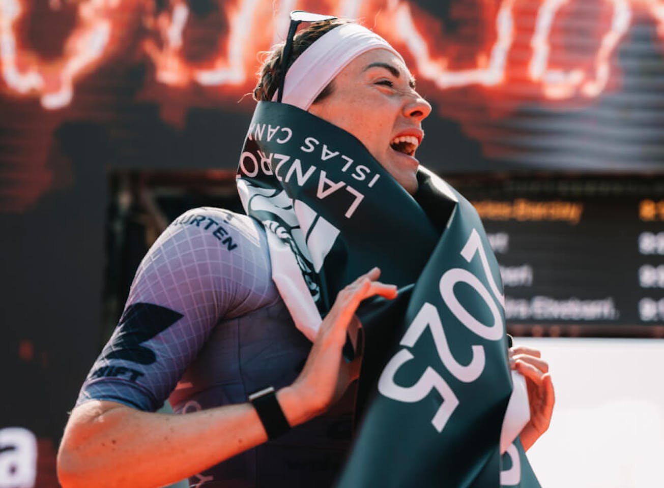 Woman celebrating a triathlon