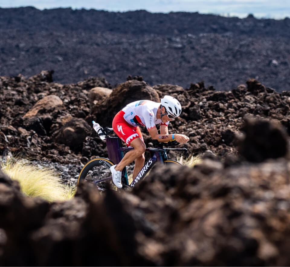 Man cycling through dirt mounds