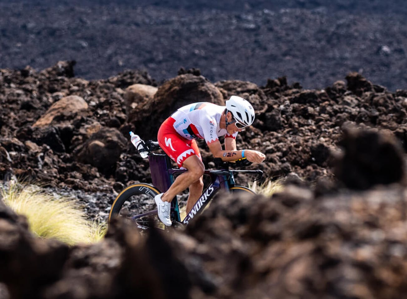 Man cycling through dirt mounds