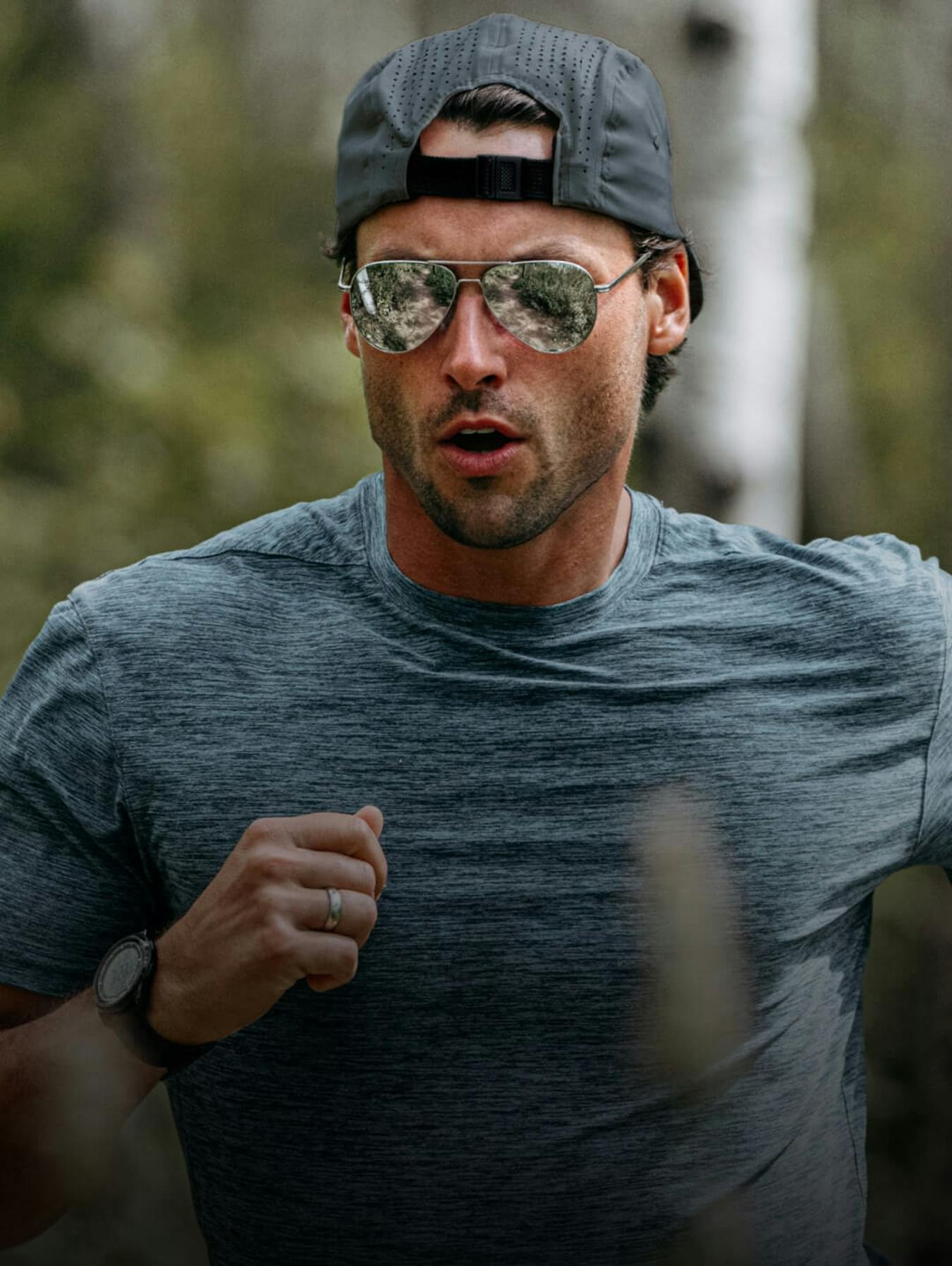 Man running in mirrored ROKA sunglasses
