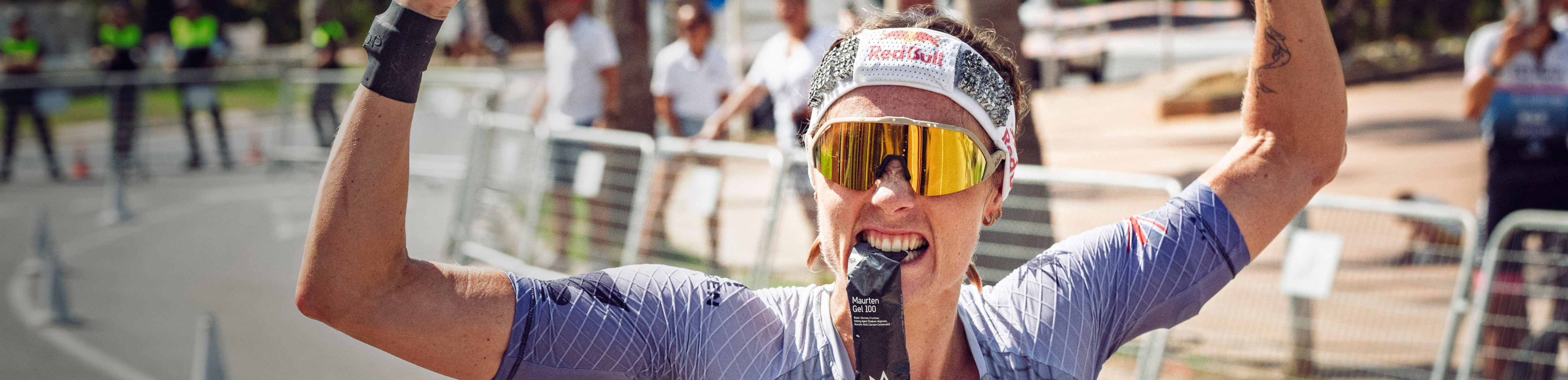 Lucy Charles celebrating in Matador AIR gold sunglasses
