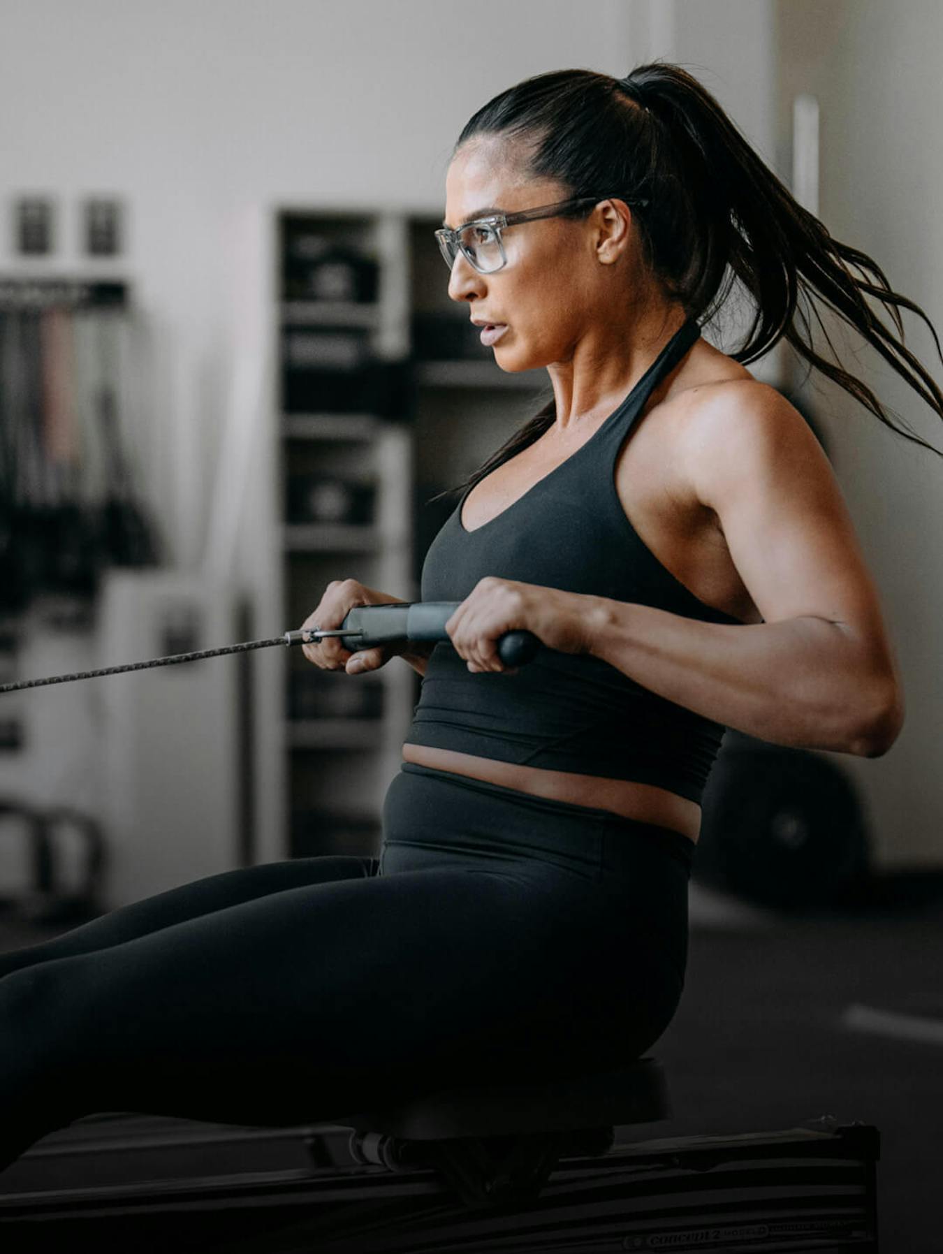 Woman working out on rowing machine