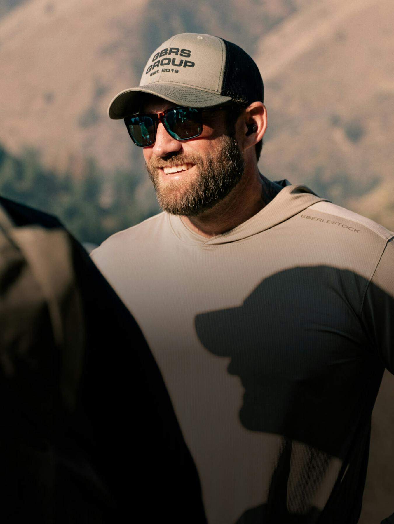 Man smiling in protective sunglasses