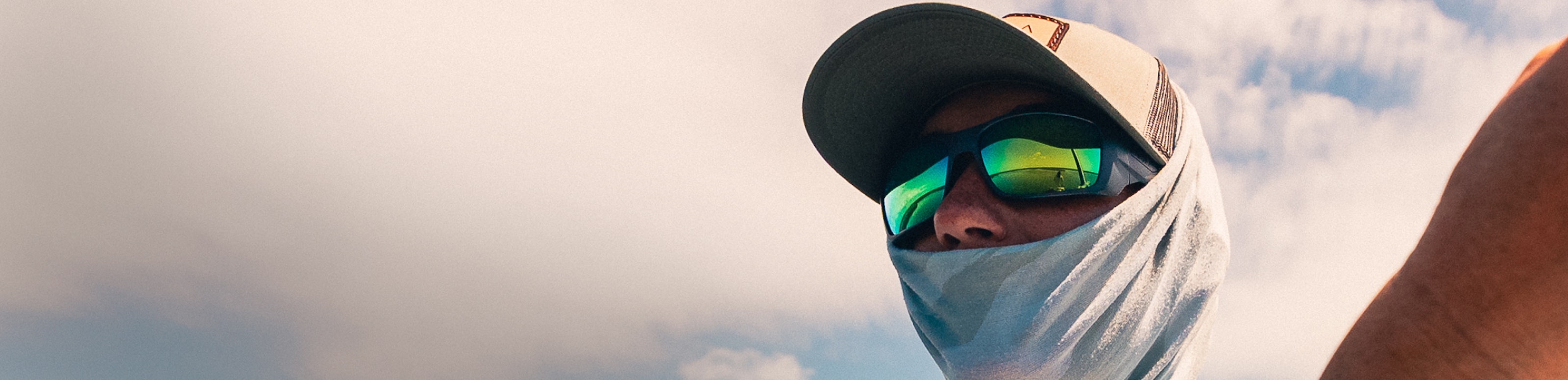 Man wearing green mirrored ROKA sunglasses