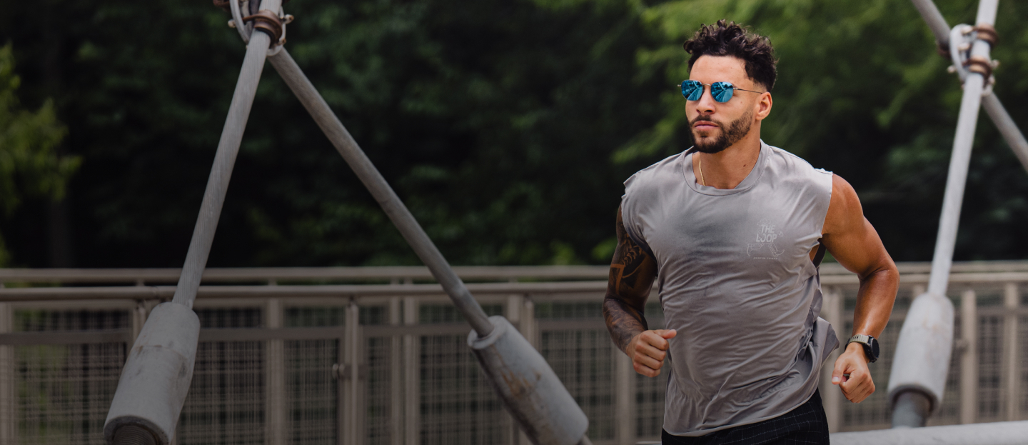 Man in grey tank and Lyno sunglasses