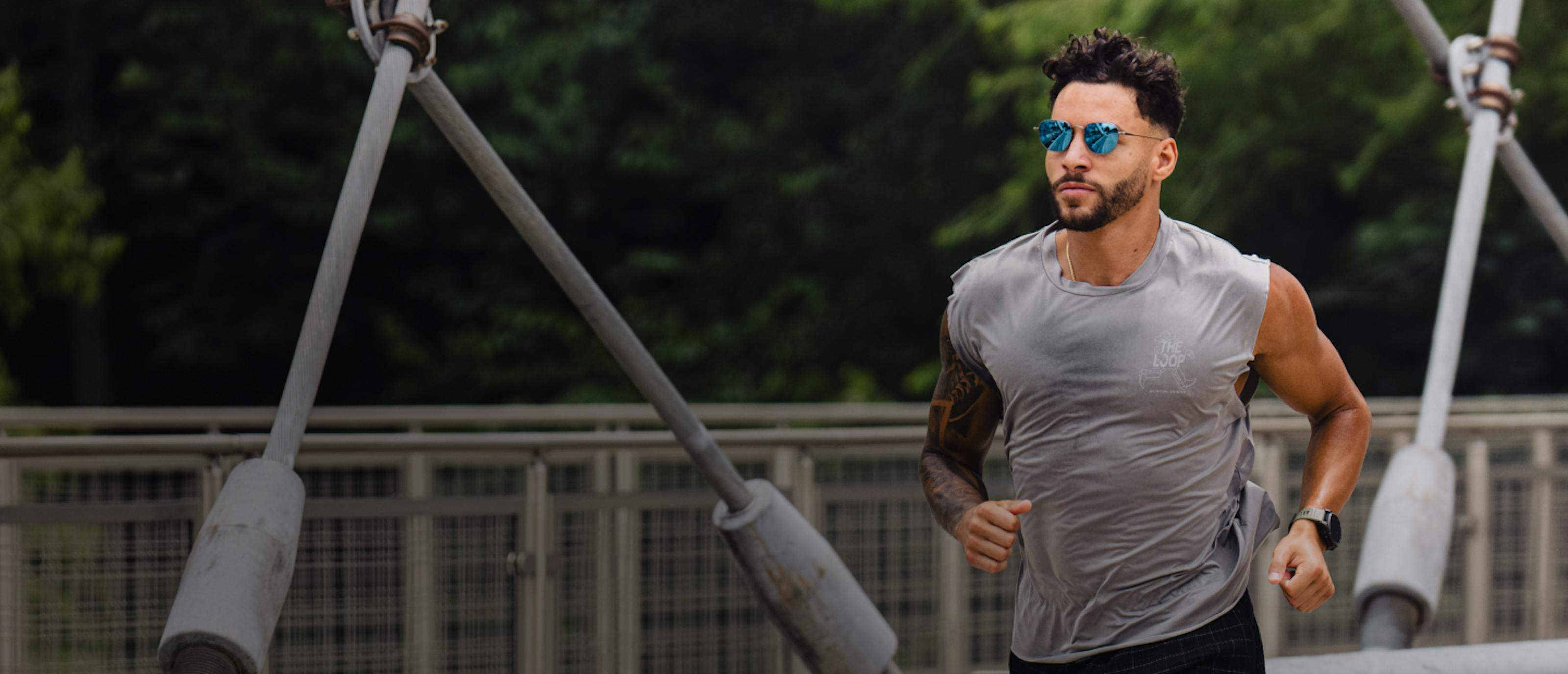 Man in grey tank and Lyno sunglasses