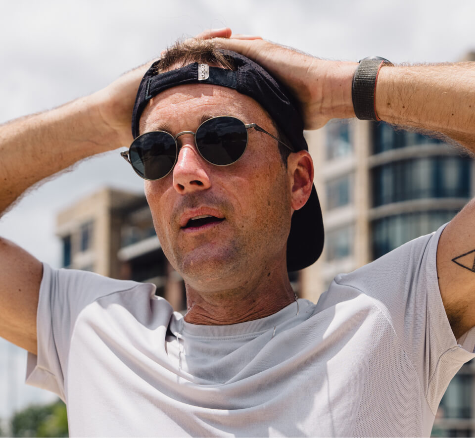 Man with hands over head wearing Alto Sunglasses