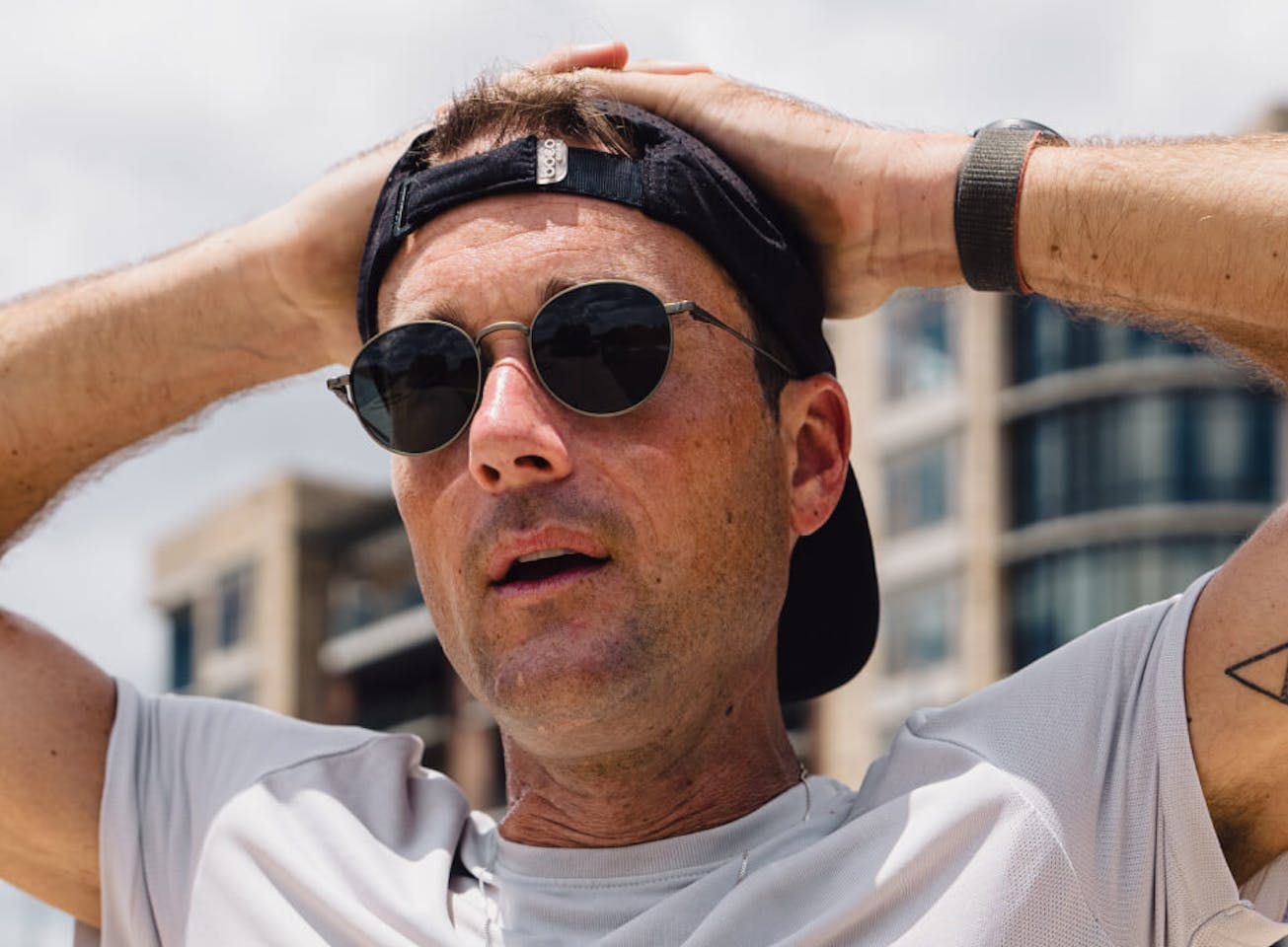 Man with hands over head wearing Alto Sunglasses