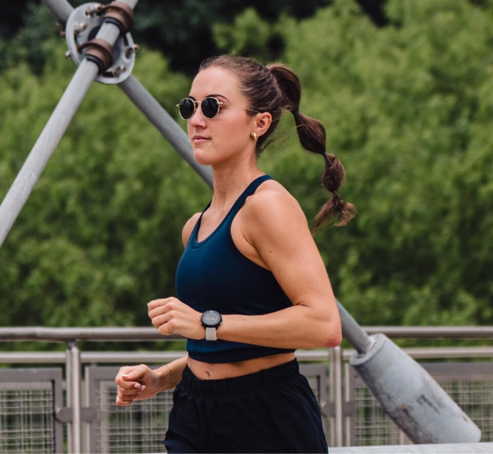 woman jogging in blue tank top and Alto Sunglasses
