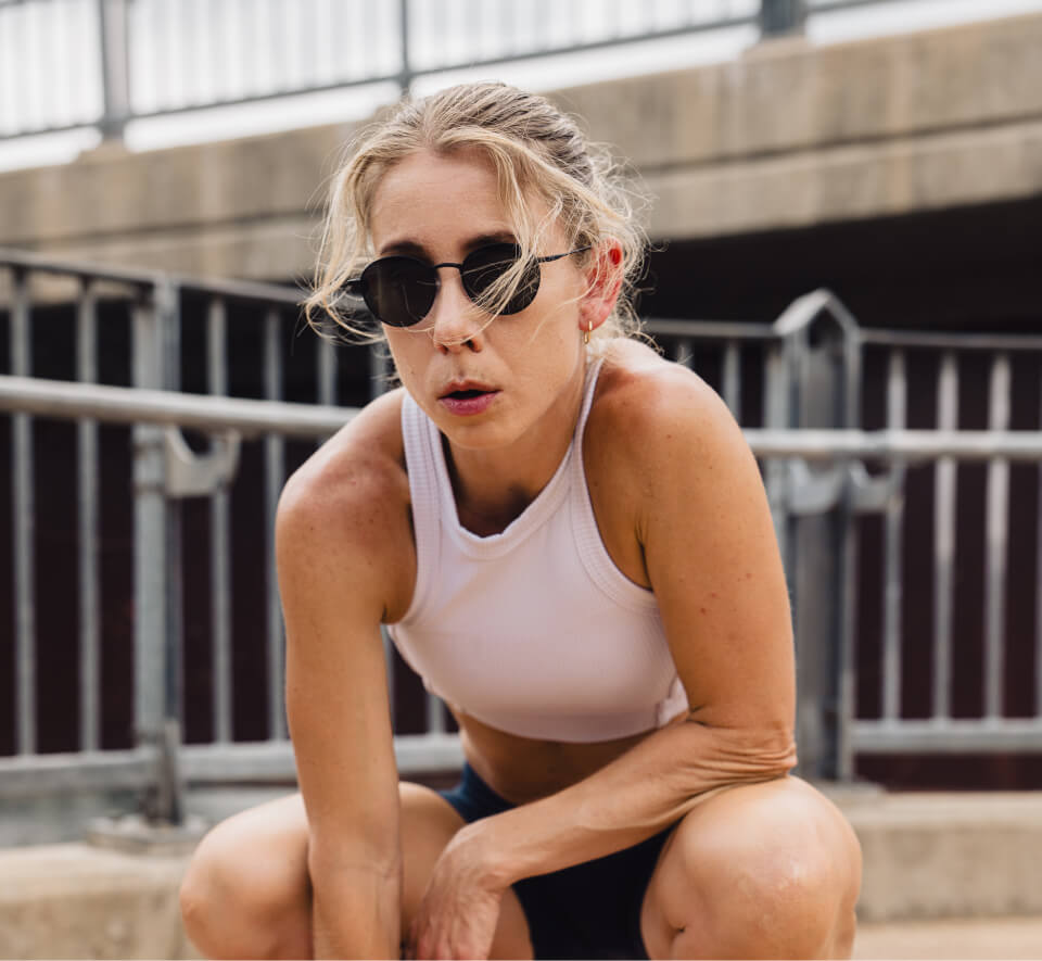 Woman wearing white tank top and Alto Sunglasses