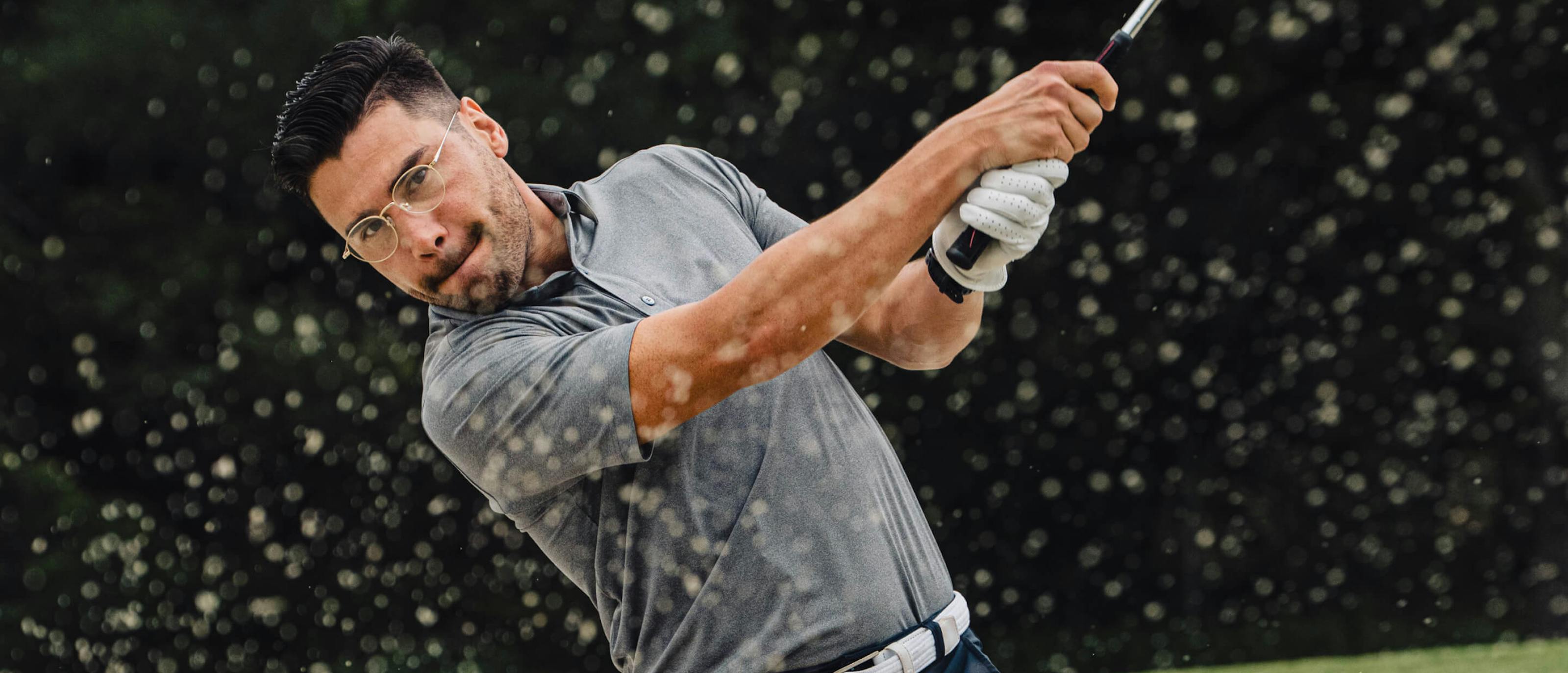 Man swinging golf club in Alto Eyeglasses