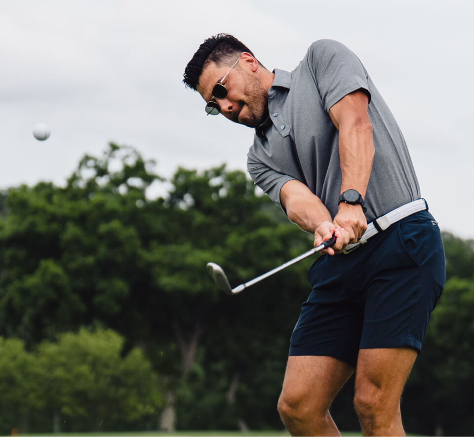 Man swinging golf club in Lyno Sunglasses