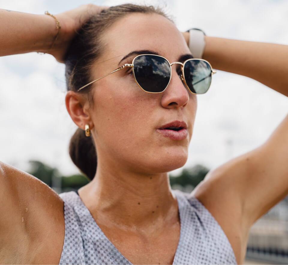 Woman with hands over head in Lyno Sunglasses