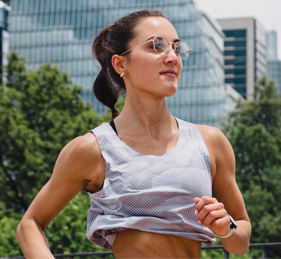 Woman jogging in grey top in Lyno Eyeglasses