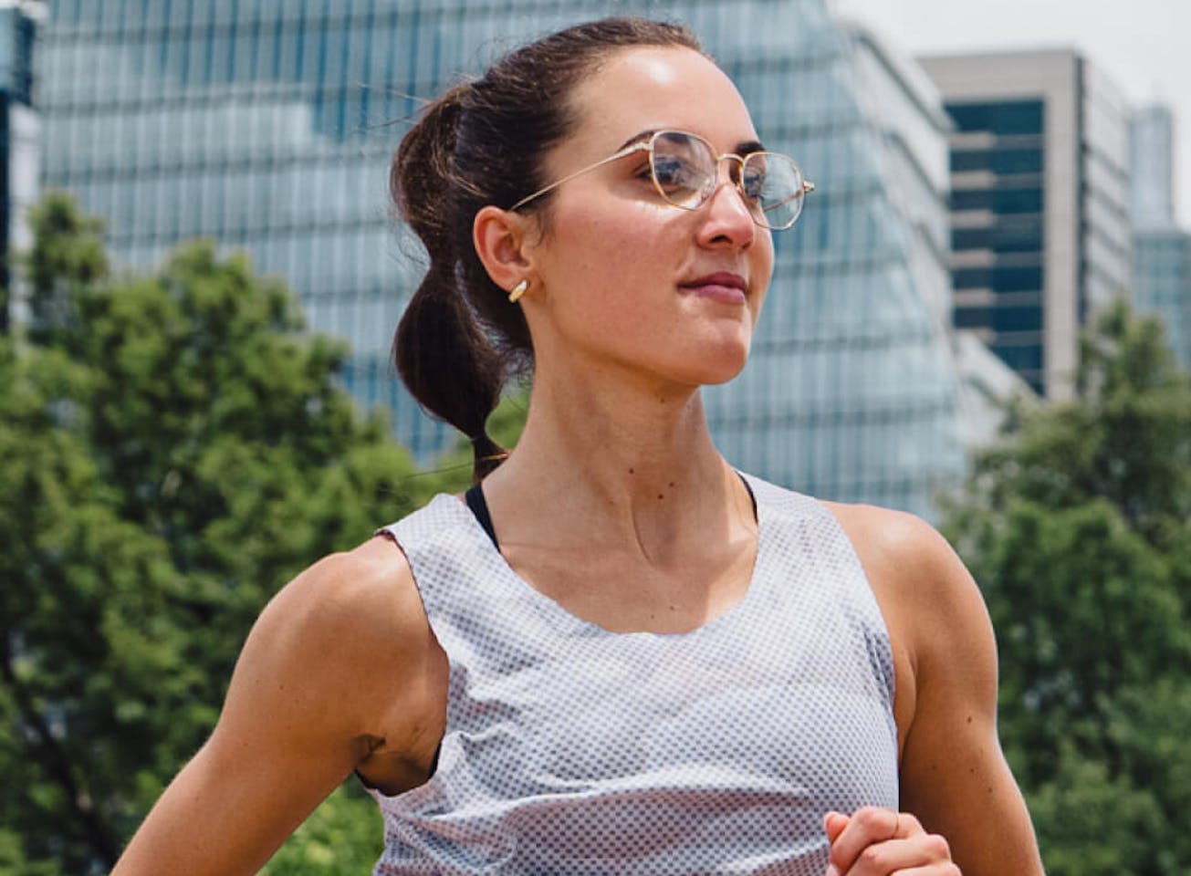 Woman jogging in grey top in Lyno Eyeglasses