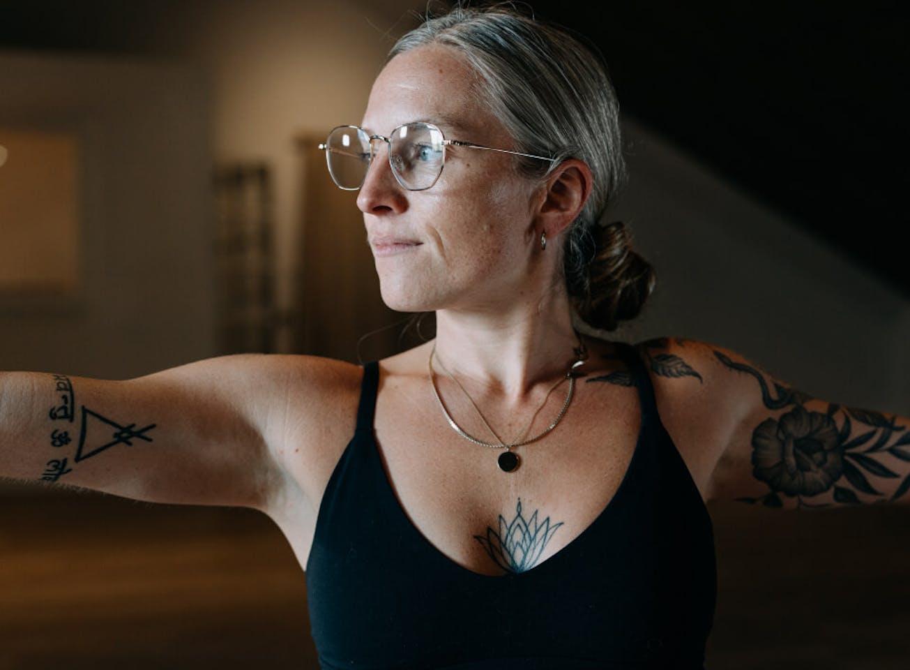 Woman doing yoga in black top in Lyno Eyeglasses