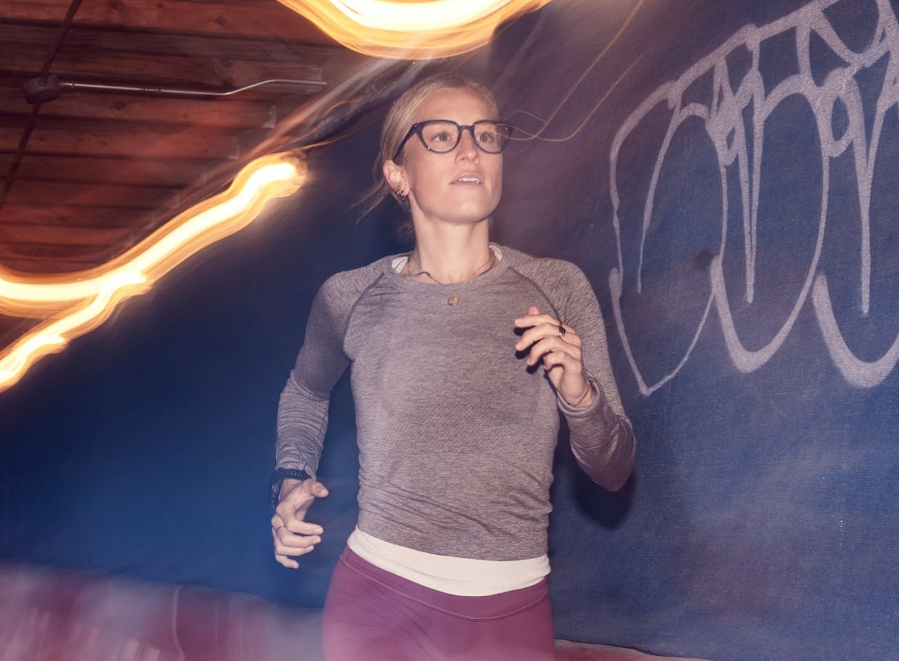 Woman running wearing cat eye shape, clear Lola eyeglasses