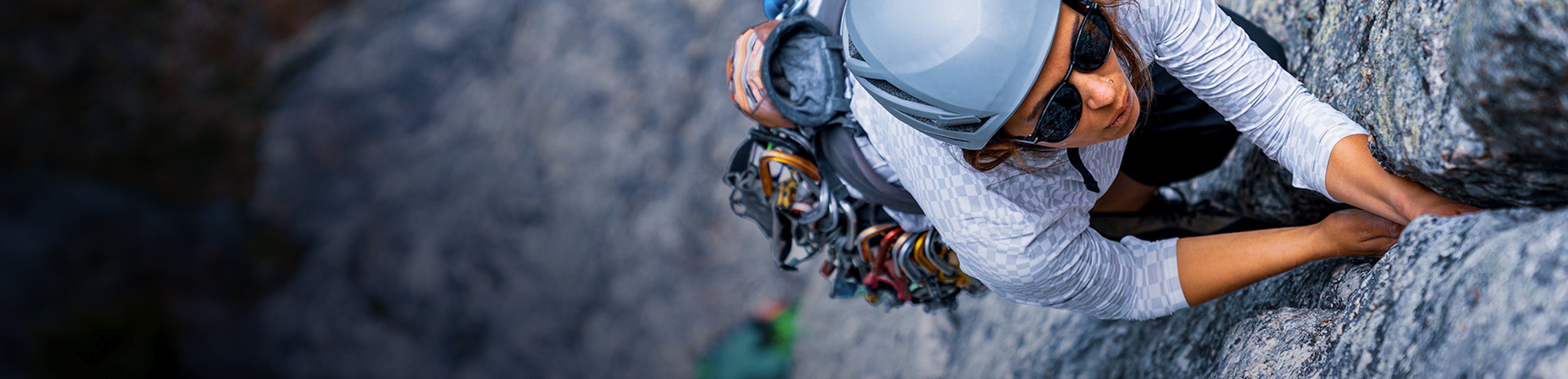 Person rock climbing wearing ROKA sunglasses.