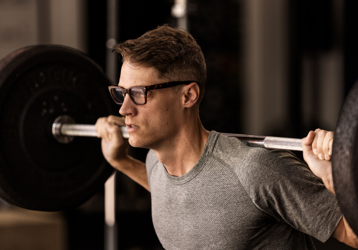 Man squatting in Lockhart eyeglasses
