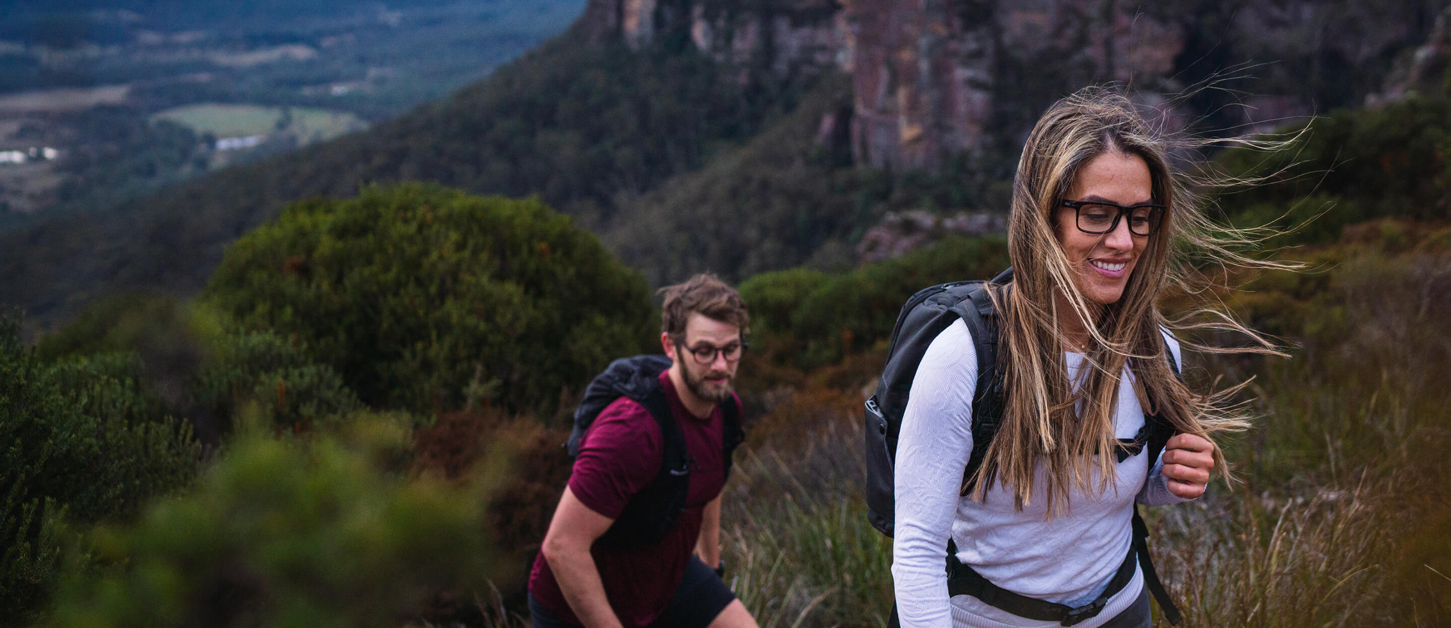 Woman and man hiking wearing Braker eyeglasses