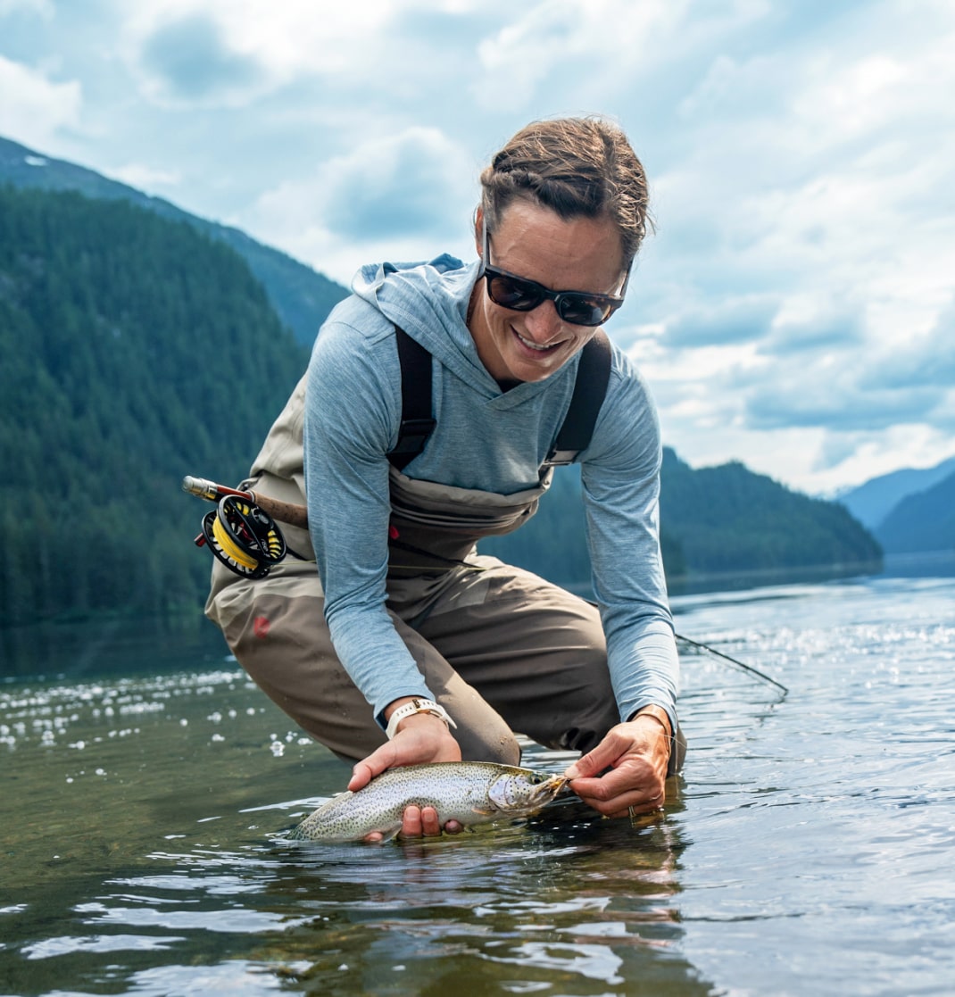 Woman catching fish wearing Lockhart sunglasses
