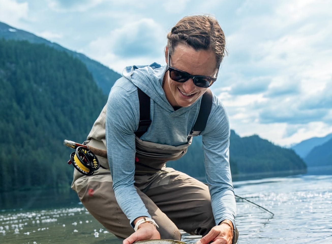 Woman catching fish wearing Lockhart sunglasses