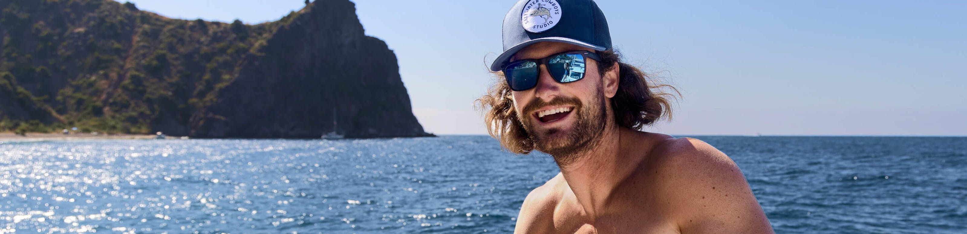Man fishing the ocean with Barton sunglasses