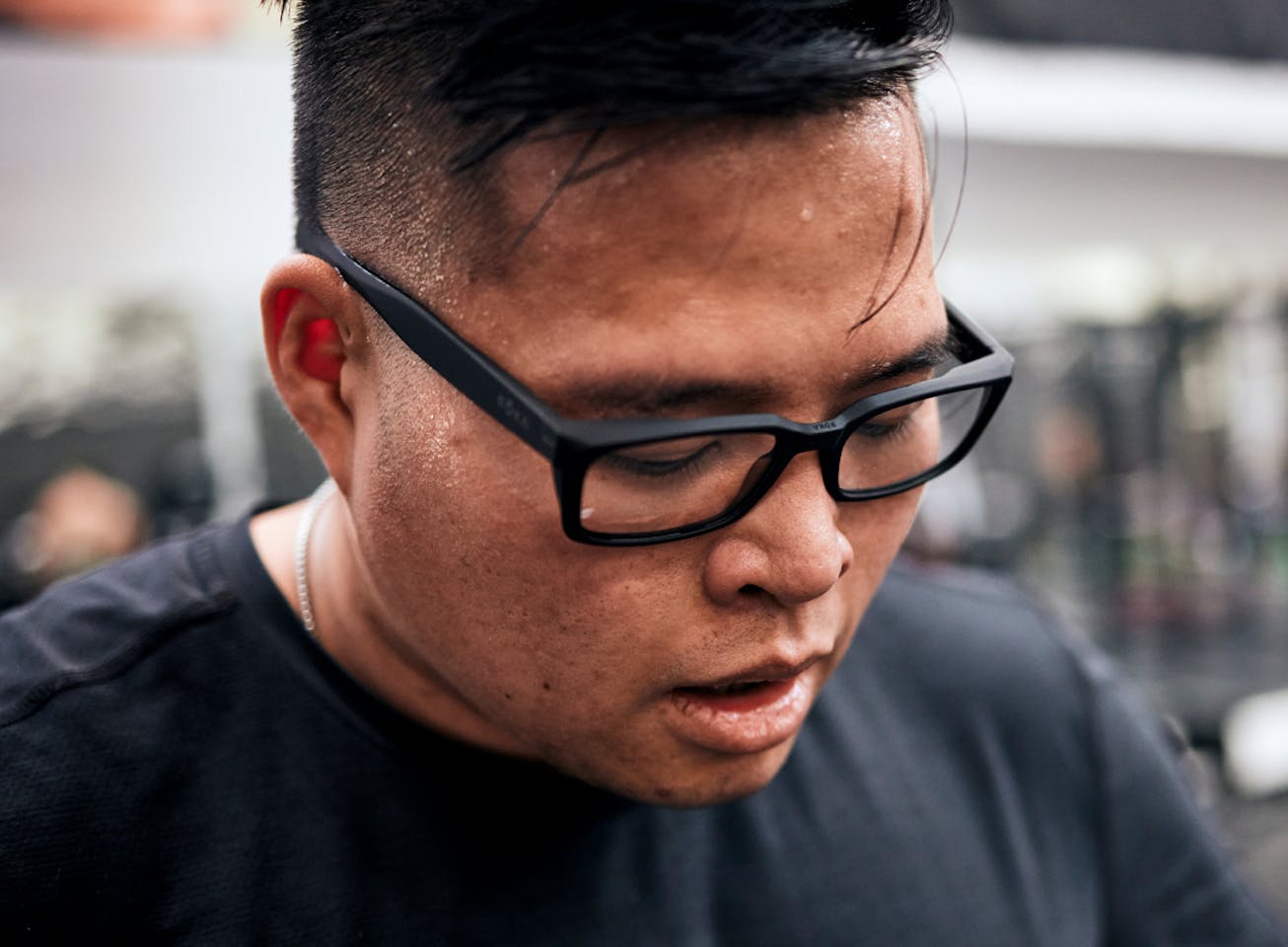 Man looking down wearing Mayfield eyeglasses