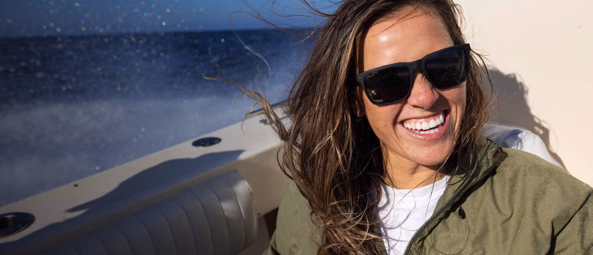 Woman smiling wearing barton sunglasses