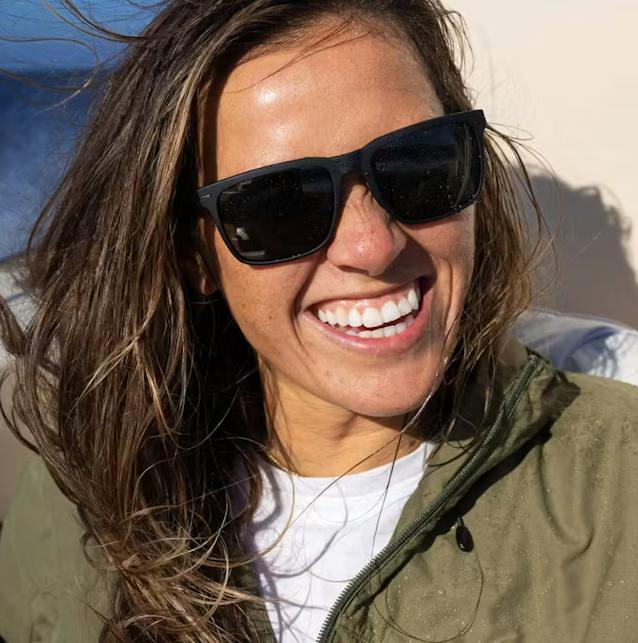 Woman smiling wearing barton sunglasses