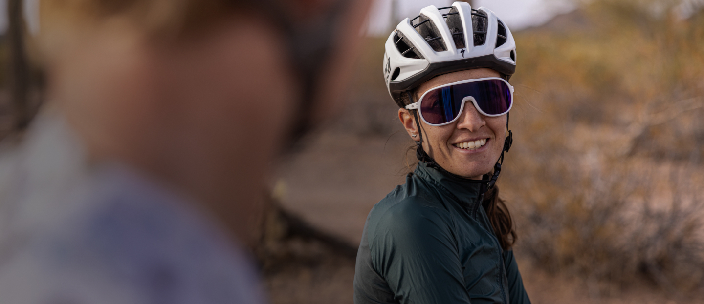 Woman wearing cycling helmet and San Remo sunglasses