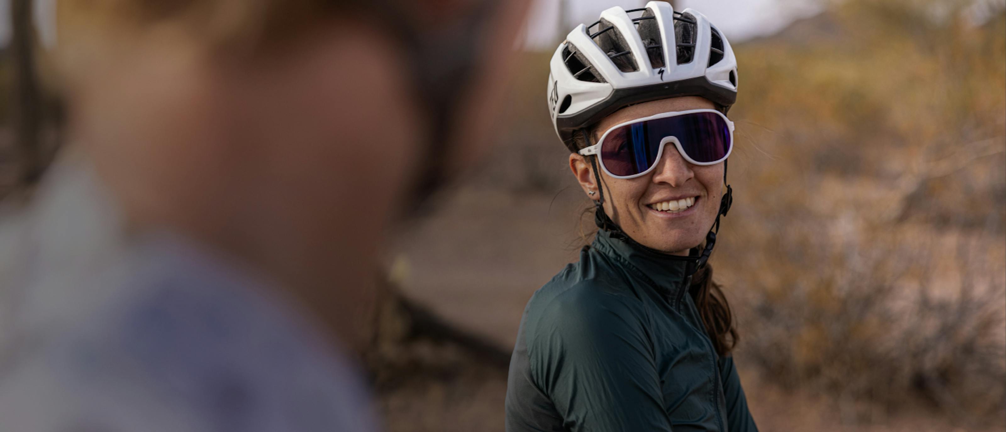 Woman wearing cycling helmet and San Remo sunglasses